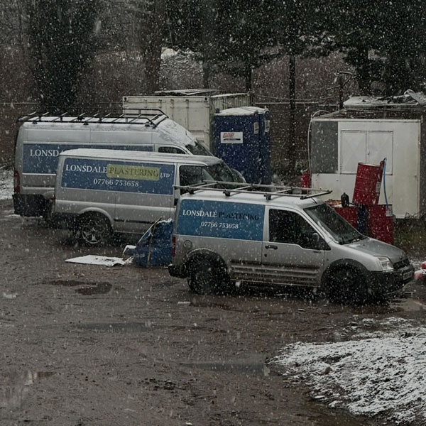Lonsdale Plastering vans in snow